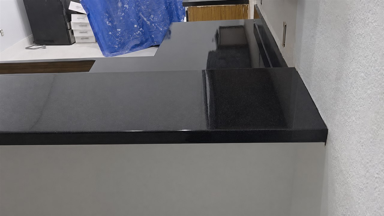 Dark refinished countertop after Sunshine Refinishing Pros completed the project